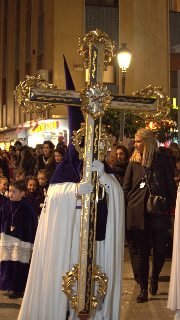 A large cross is carried by the procession leader of each brotherhood.