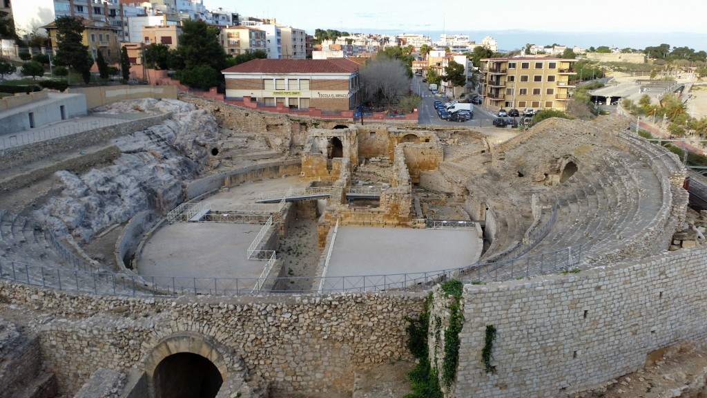 Tarragona amphitheatre. Christians were martyred here, so the local Christians decided to build a church in the middle of the arena (the big crucifix shaped building).