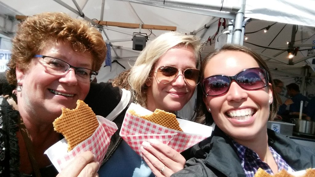 Enjoying fresh stroopwafels with Alie and Marjon.
