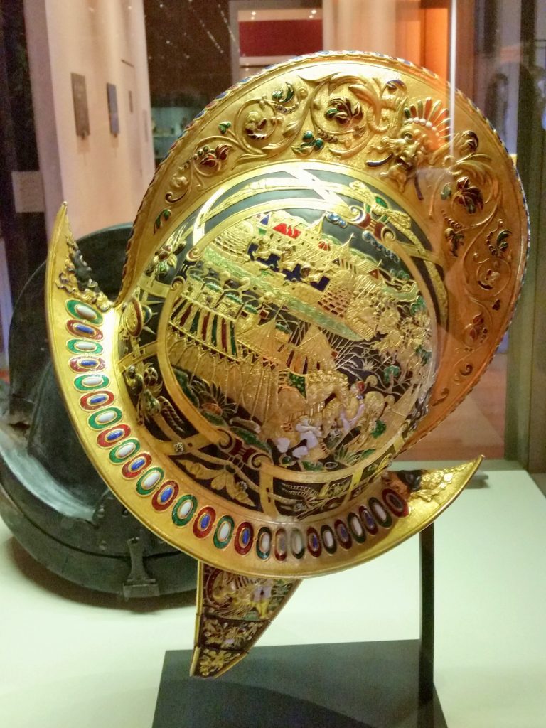 The fanciest helmet we've ever seen. It's completely covered in gold, coloured enamel and really really detailed pictures.