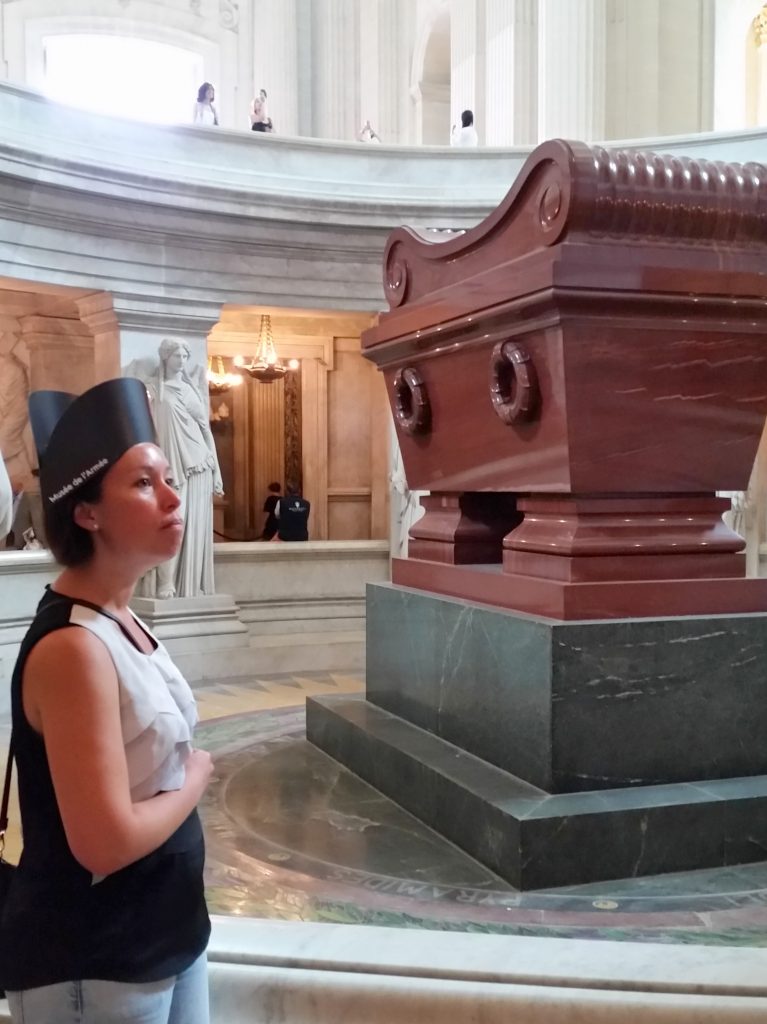 Napoleon's (bloody big) tomb. The red stone sarcophagus plus base is probably 4-5m tall (look how small the guys are in the background if you don't believe me). Also, they hand out free cardboard Napoleon hats at the ticket office!