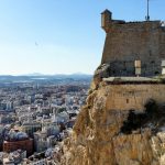 The Santa Barbara Fortress perched on top of a cliff, overlooking the city of Alicante.