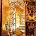 Ornate gold and silver doors guarding the relics of many Catholic saints in the church of San Juan de Dios. Granada.