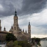 Zaragoza's Basilica Pilar under stormy skies.