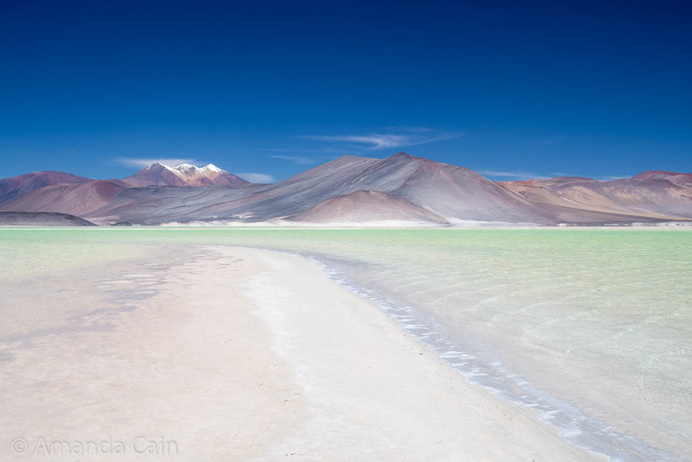 The mountains and lagoon next to the 'red stones' (Piedras Rojas).