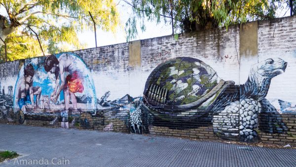 This wall which belongs to a school is a popular wall for murals.