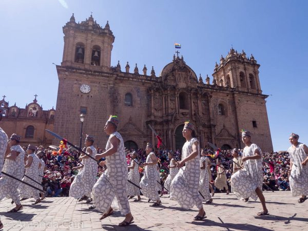The Inca's soldiers march past the cathedral.