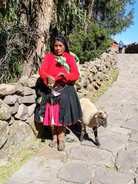 Life around Lake Titicaca is still very traditional. On Taquile Island (famous for its high quality weavings) you can see women spinning wool as they walk around the village.