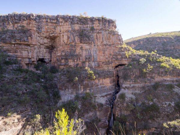 On the other side of the canyon you can see a waterfall with a cave above it.