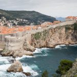 The Old Town of Dubrovnik rising above a stormy sea.