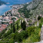 The fortifications of Kotor marching down the mountain towards the old town.