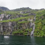 A yacht enjoying the stunning scenery of Norway's Trollfjord.