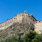 Edinburgh Castle perched on top of a steep crag.
