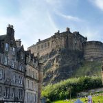 Edinburgh Castle towering over the buildings of the Grassmarket.