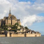 Mont Saint-Michel rising out of the bay at sunrise.