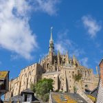 The fortified monastery of Mont Saint-Michel rising high above the buildings of the town.