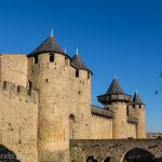 The entrance to the fairy tale castle of Carcasonne in the morning light.
