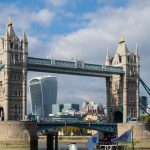 The old Tower Bridge and the modern London skyline behind.