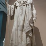 Marble statue of Napoleon in his coronation robes, in the Louvre Museum.