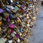 Love locks completely covering the Pont Neuf in Paris.