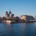 Notre Dame Cathedral on the banks of the Seine River in Paris.
