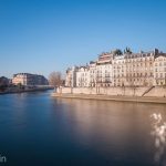 Notre Dame Cathedral, and Parisian apartments on the banks of the Seine River.