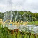 Modern fountain inside the gardens of Versailles.