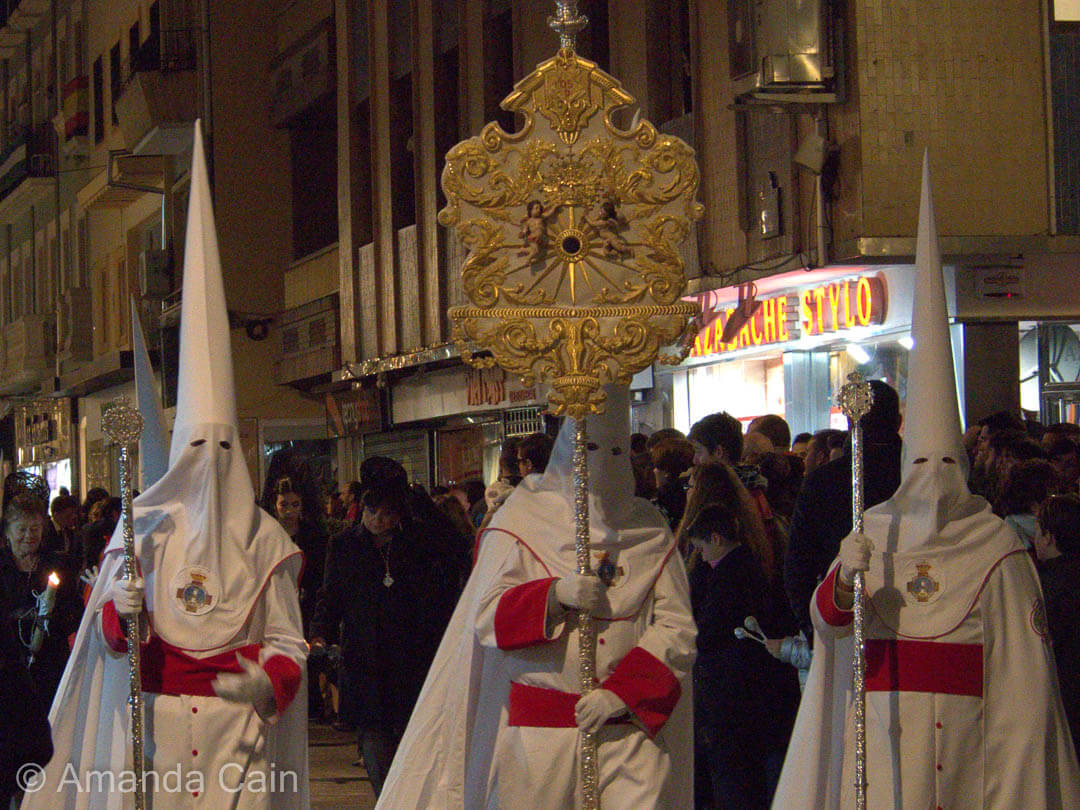 Penitents marching through the streets of Granada for Semana Santa.