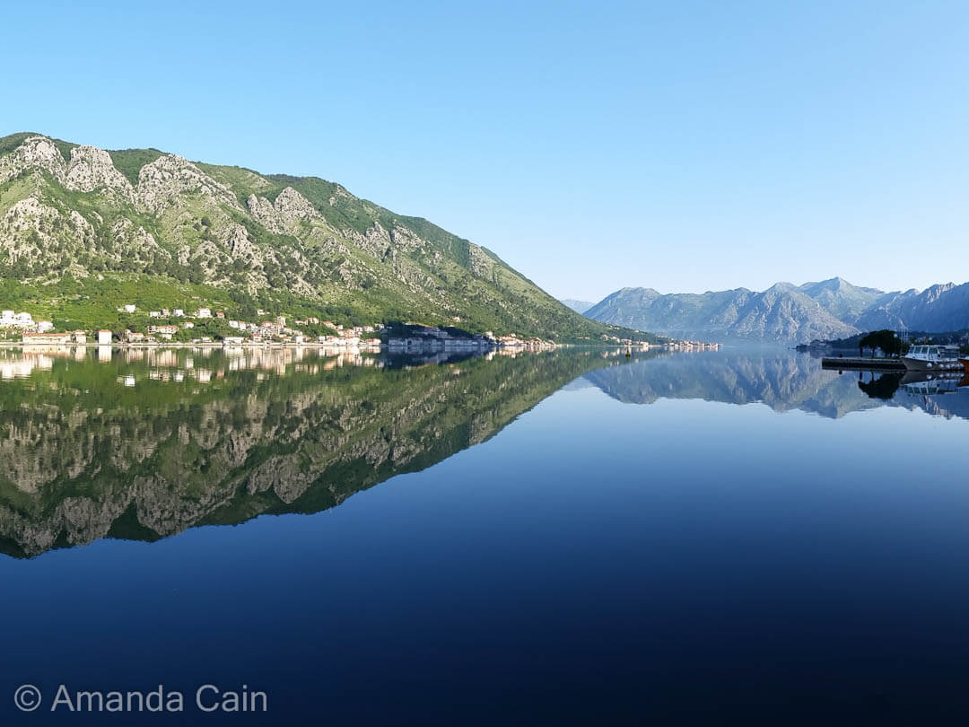 The glassy-smooth waters of the Bay of Kotor.