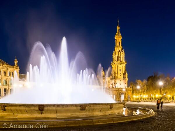 An evening stroll through the Plaza de España in Seville.