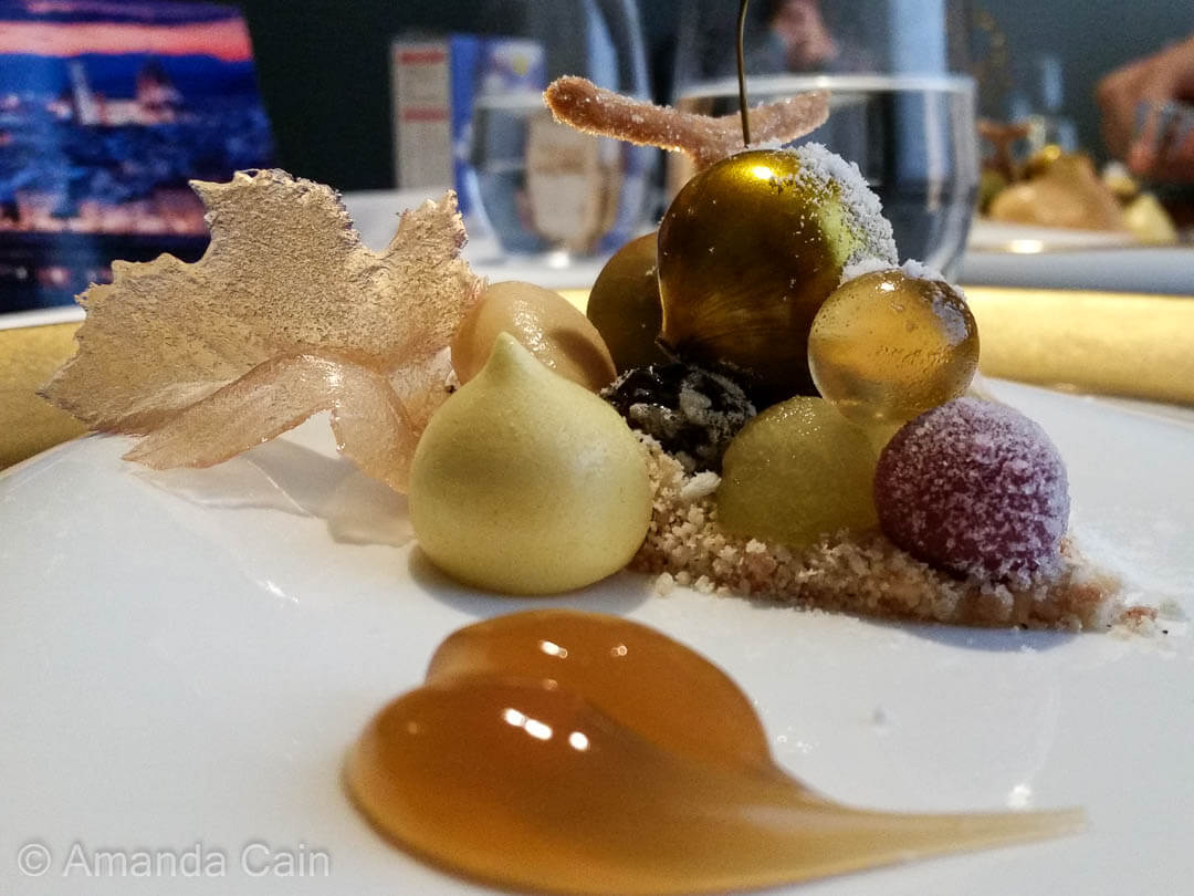 One of several desserts to enjoy during a meal at the Fat Duck. This one combines all the flavour elements of dessert wine in separate spheres.