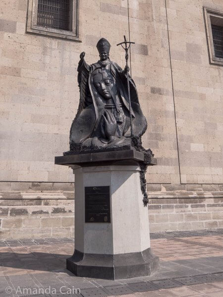 A statue of Pope John Paul II outside Mexico City Cathedral.