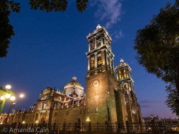 Puebla Cathedral lit up at night.