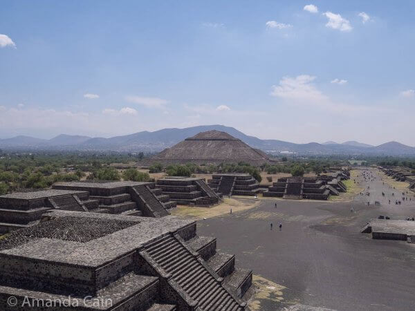 Small pyramids surround Teotihuacan's Plaza of the Moon, with the Pyramid of the Sun in the background.
