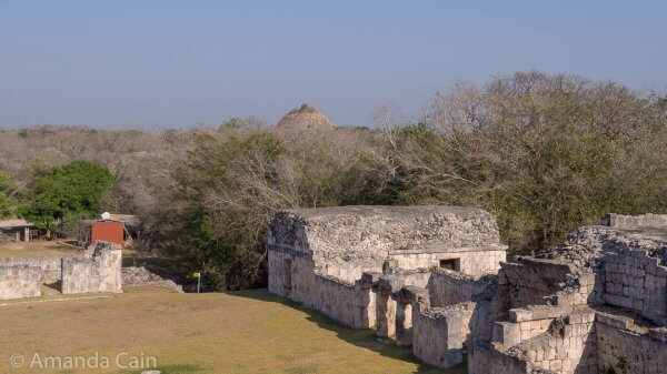 Very little of Kabah has been excavated. In this picture you can see a pointy thing in the background sticking up over the trees. That's the Great Pyramid of Kabah, still unexcavated.
