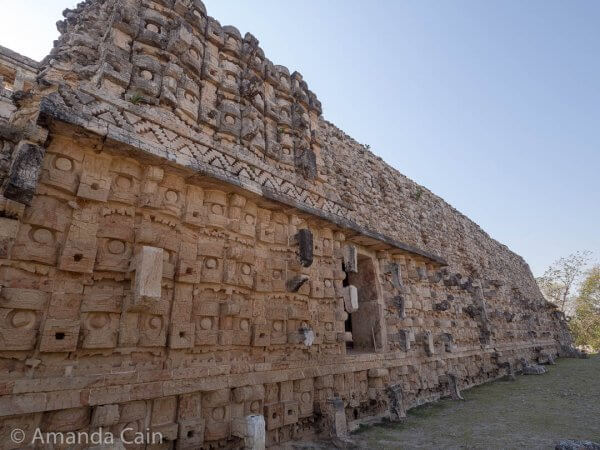 The Palace of the Masks in Kabah. The entire surface of this building is covered in "masks" representing the rain god Chaac.
