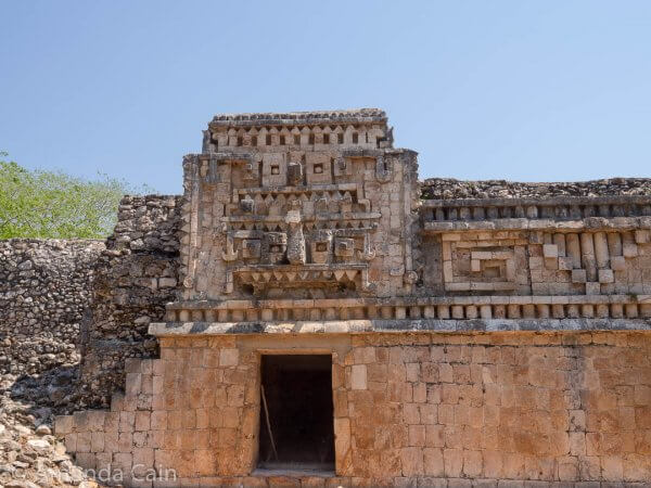 A palace at Xlapak with a mask of the rain god Chaac above the door.