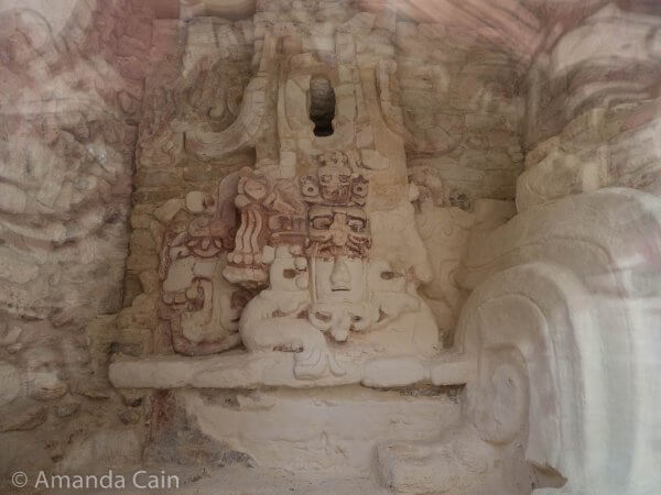 A plaster "mask" of the Mayan sun god. Plaster masks and sculptures haven't survived well over the years, so seeing this one in such good condition is very special.