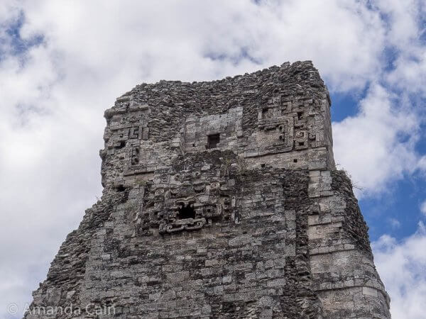 The back side of the central tower of Xpujil. You can see a jaguar face sticking out from the centre of it.